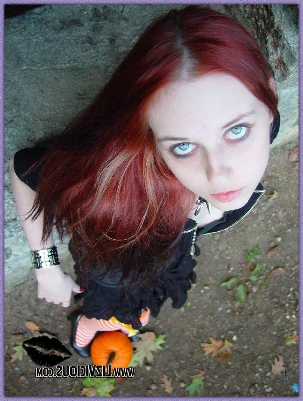 15P Hot gothic babe Liz plays with a pumpkin