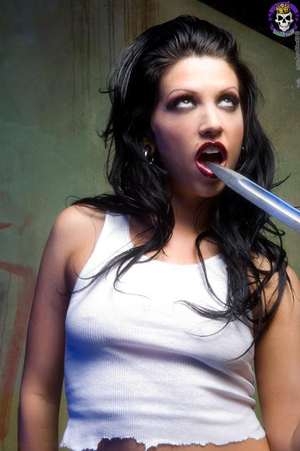 15P hot brunette gothic girl plays with a knife