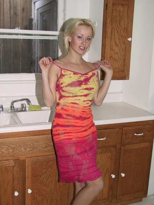 15P Hot blonde wife shows her nice butt in the kitchen