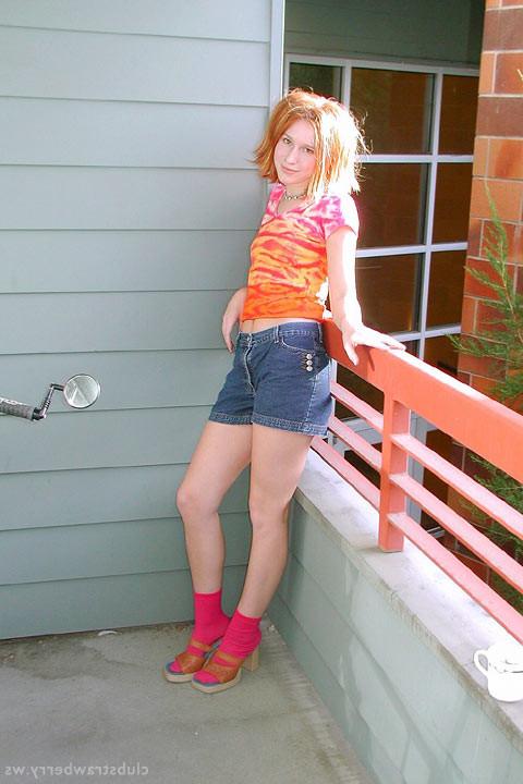 16P Redhead cutie strips and fingers her ass