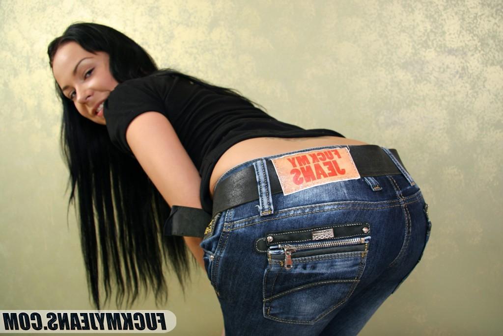 18P Sexy chick with dark hair and big boobies posing in tight blue jeans