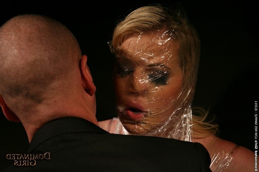 12P The creative master wrapped Anita Blue in plastic