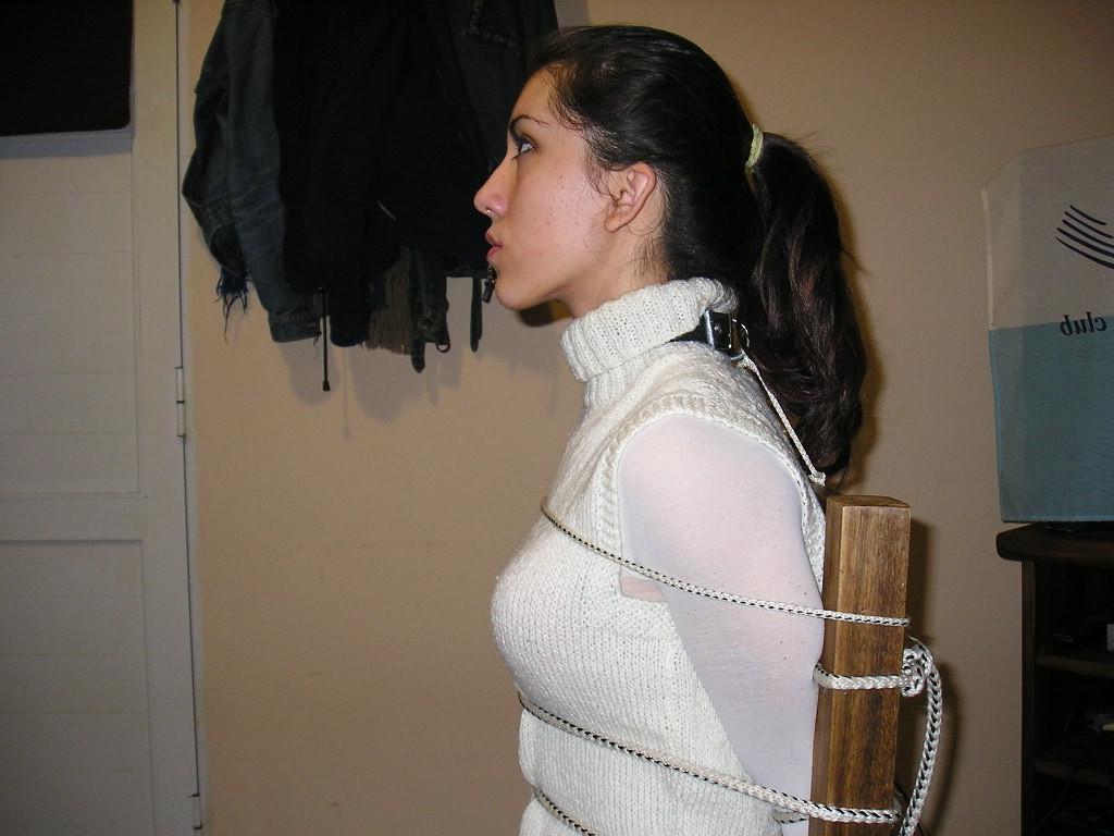 12P Young college girl tied down to a chair