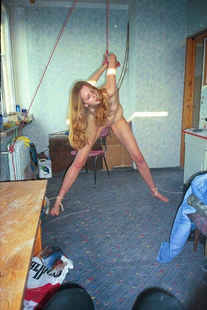 12P Cute brunette chained down and teased