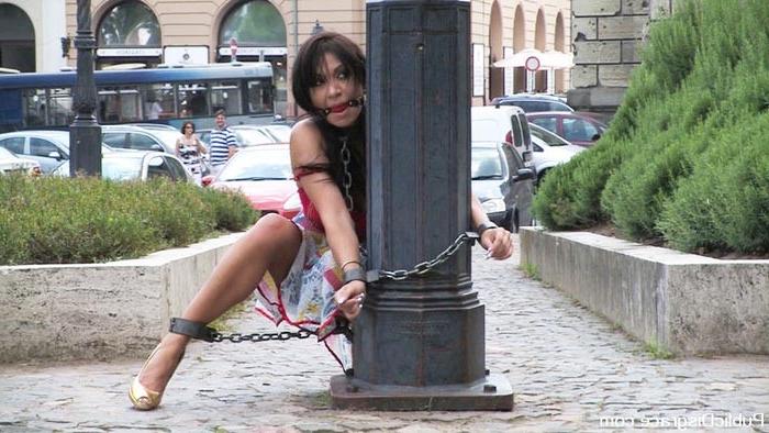 15P Busty brunette sub forced to suck cock in public