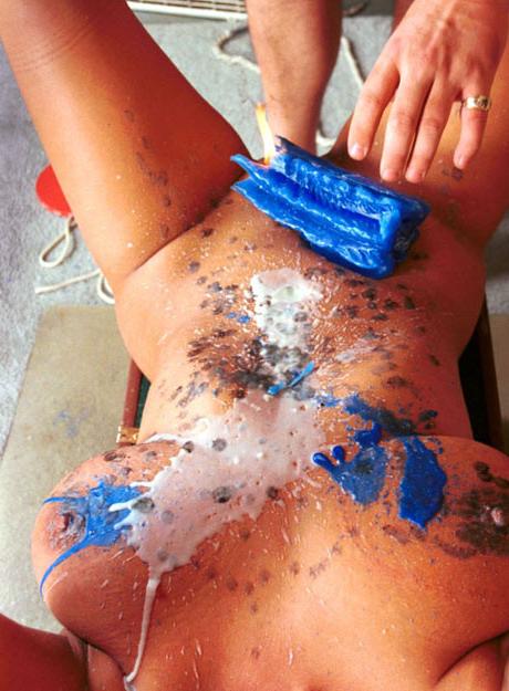 15P Busty fetish babe drenched in colorful wax