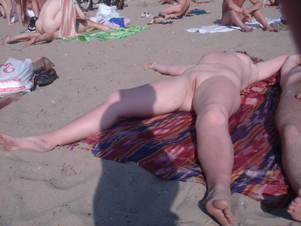 15P Gorgeous blonde young nudist plays in the water