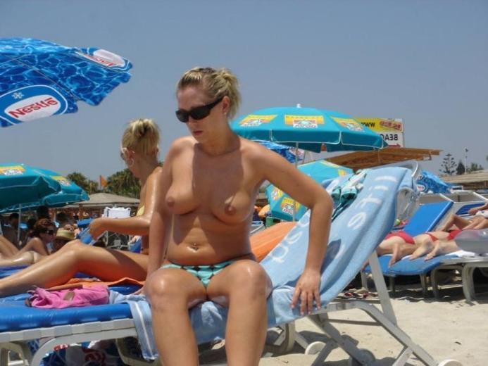 15P Gorgeous blonde young nudist plays in the water