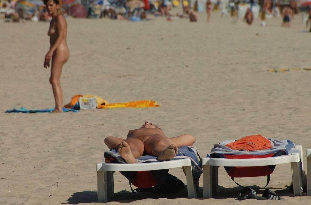 15P Wild redhead teen dances nude at a public beach