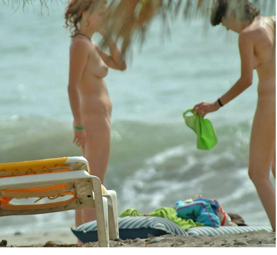 15P Gorgeous blonde Russian nudist sunbathes naked