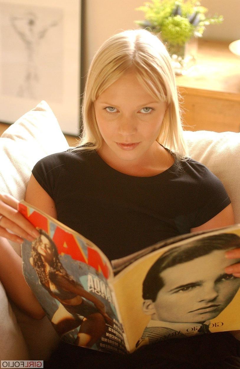 12P Beauty blonde in her black top and lace skirt poses on the sofa