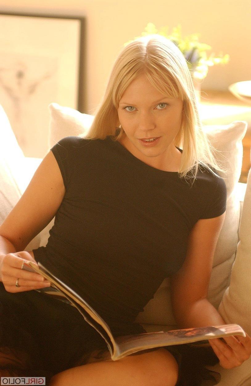 12P Beauty blonde in her black top and lace skirt poses on the sofa