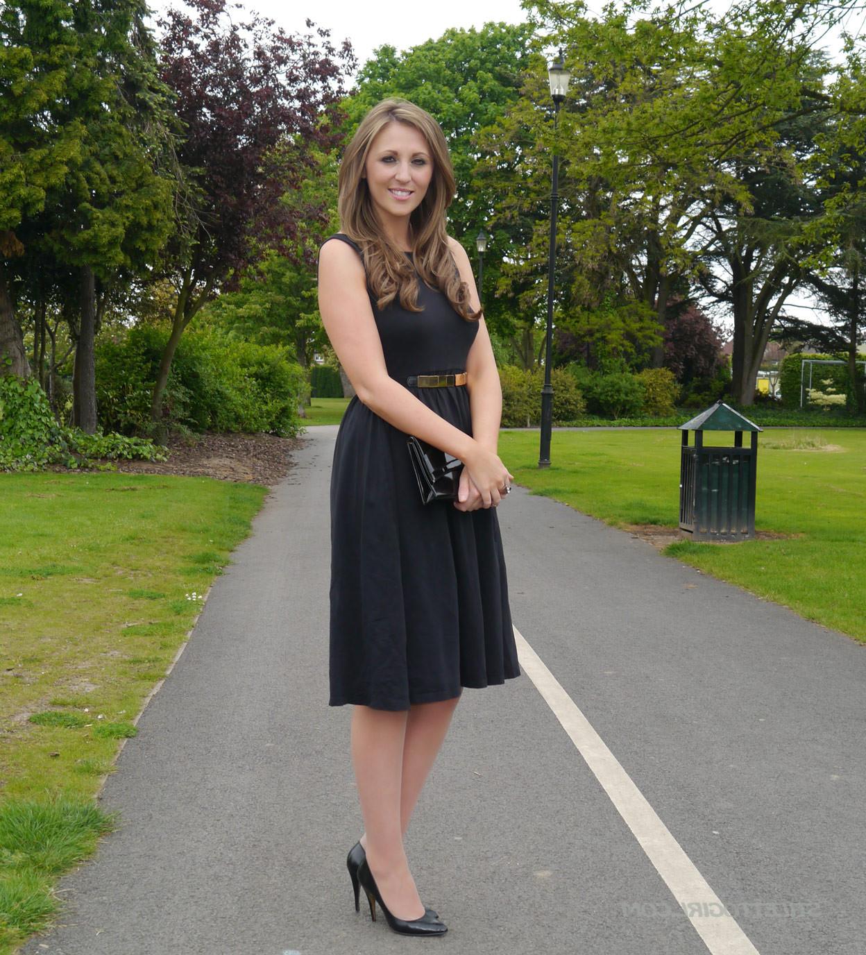 16P Sexy brunette takes a stroll into the park in a pretty dress and