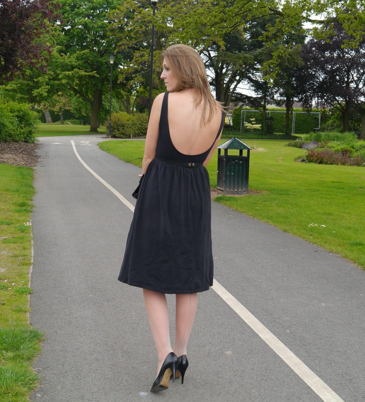 16P Sexy brunette takes a stroll into the park in a pretty dress and