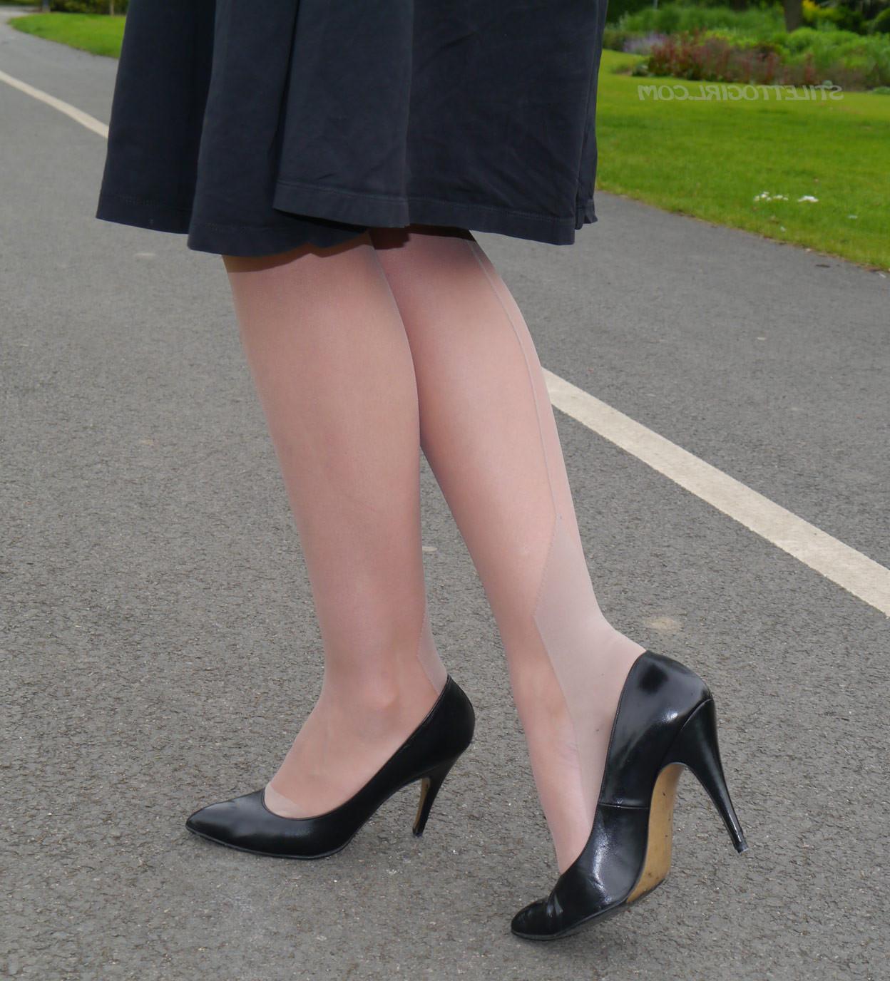16P Sexy brunette takes a stroll into the park in a pretty dress and