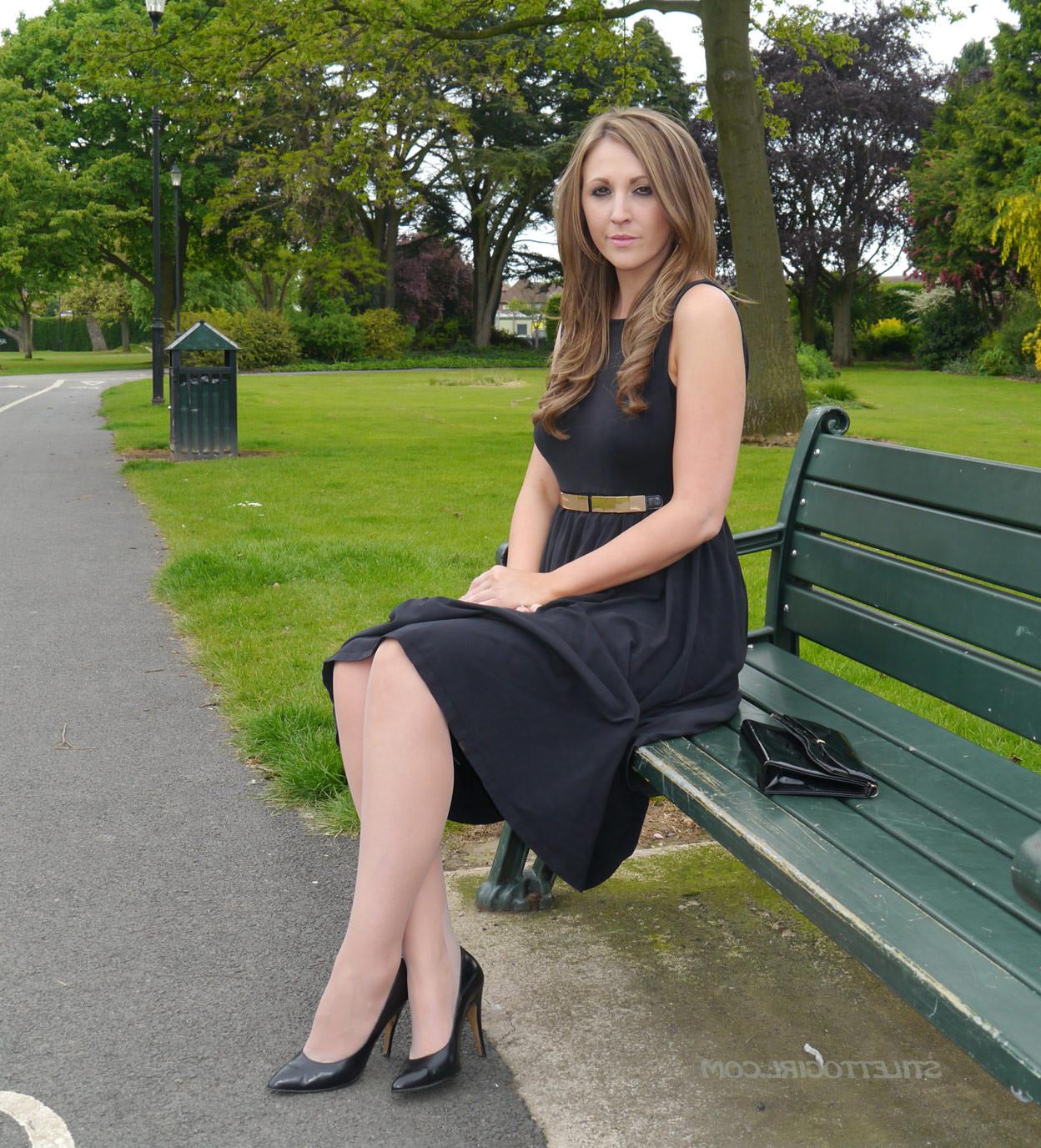 16P Sexy brunette takes a stroll into the park in a pretty dress and