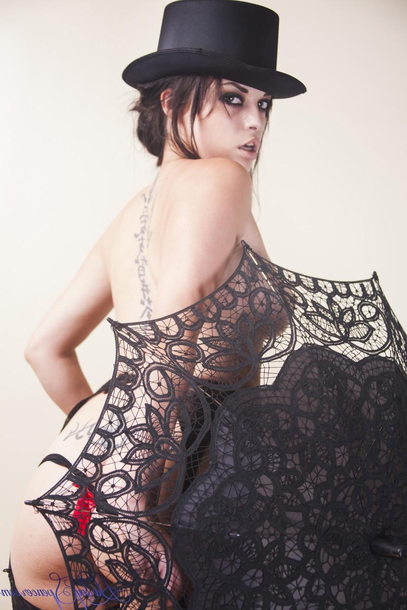 16P Hot brunette in sexy lingerie poses with a lace umbrella