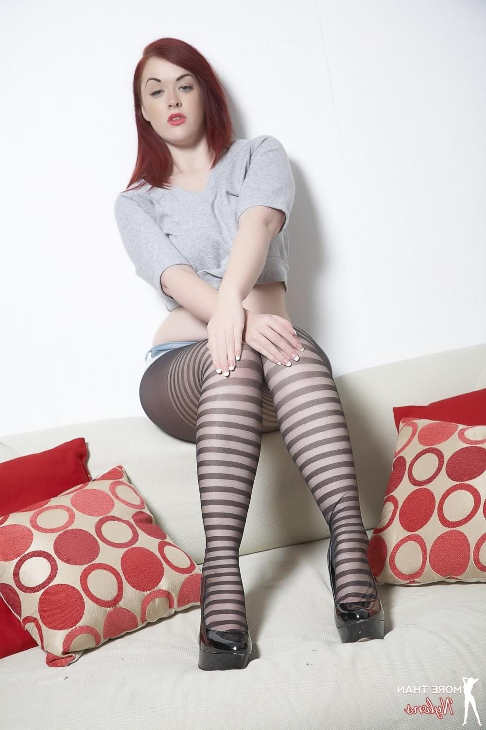 12P Busty redhead beauty in her sexy patterned tights