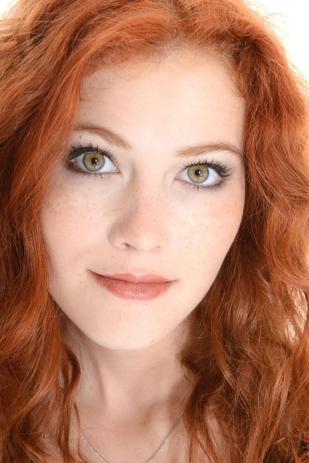15P Beauty redhead girl strips out of her tight leopard dress
