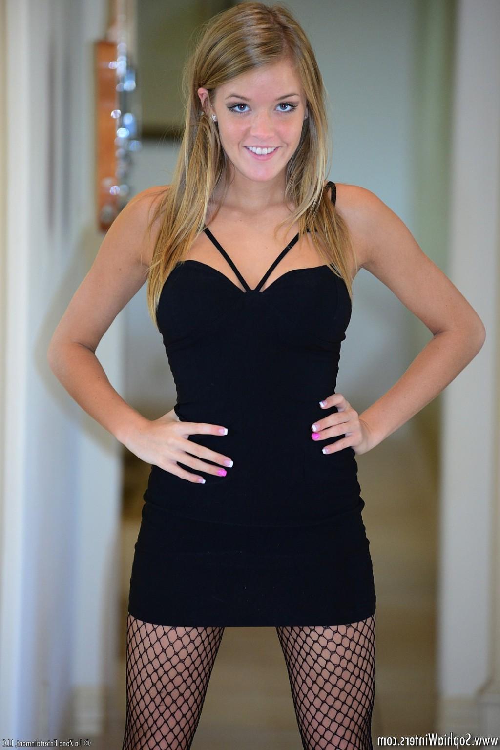 15P Sophia Winters strips off her tight black dress and pantyhose to pose naked