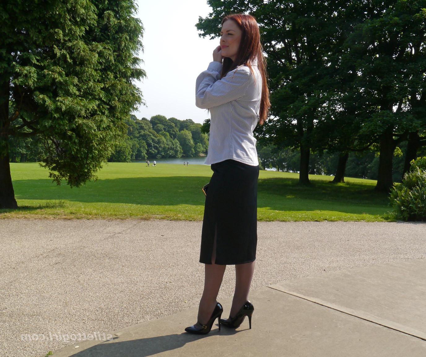 16P Hot office babe is outdoors posing in a pair of silky nylon stockings and stunni