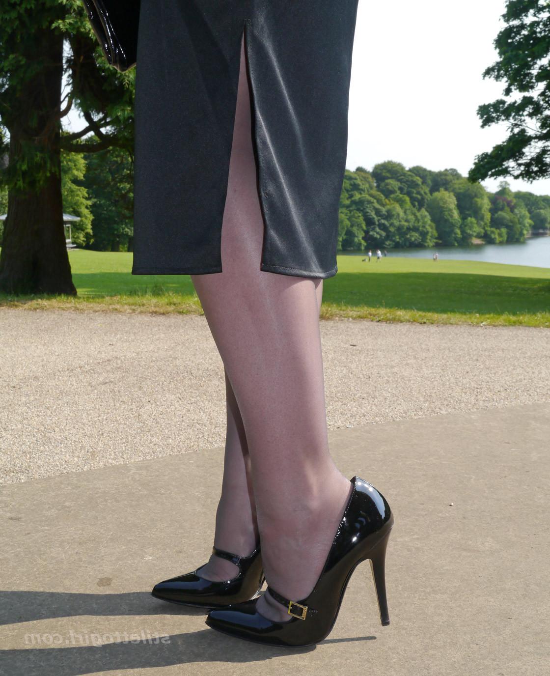 16P Hot office babe is outdoors posing in a pair of silky nylon stockings and stunni