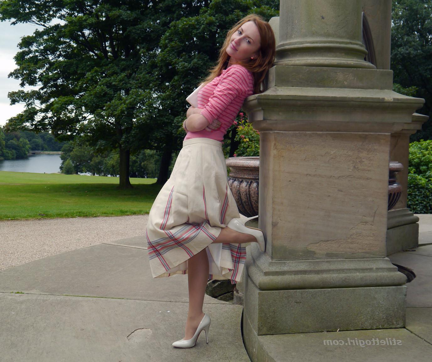 15P Cute redhead babe poses in a pair of lovely white high heeled stilettos for all 