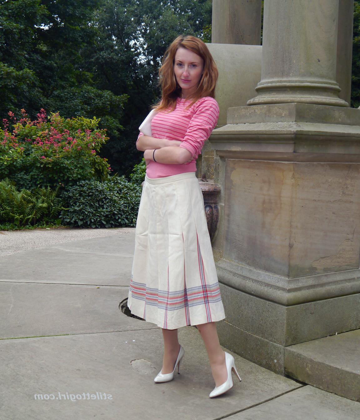 15P Cute redhead babe poses in a pair of lovely white high heeled stilettos for all 