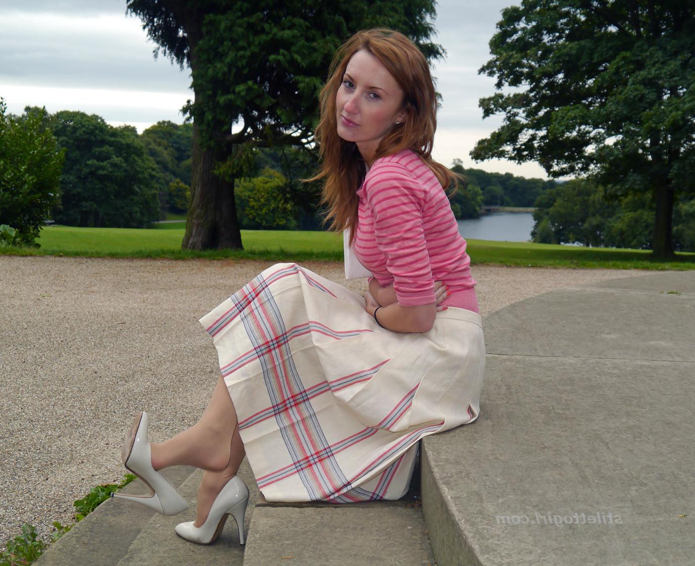 15P Cute redhead babe poses in a pair of lovely white high heeled stilettos for all 