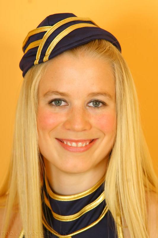 16P Busty blonde Gabriella wearing a sexy air hostess uniform with stockings