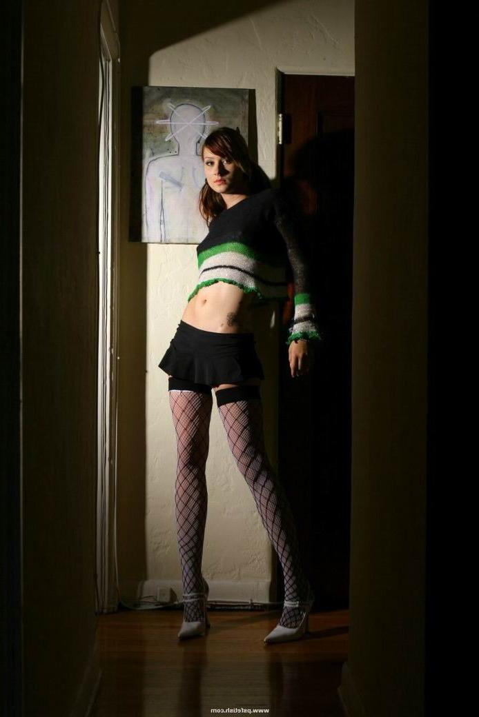 15P Erotic redhead teen hot in her stockings