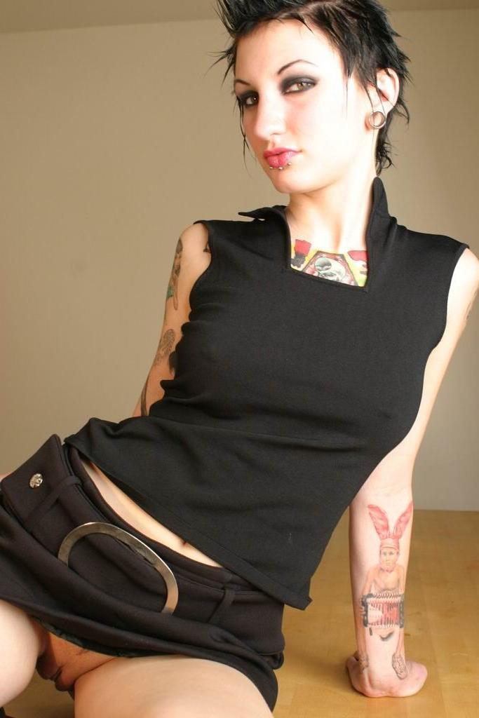 16P Pierced goth girl revealing all her piercings and naked secrets
