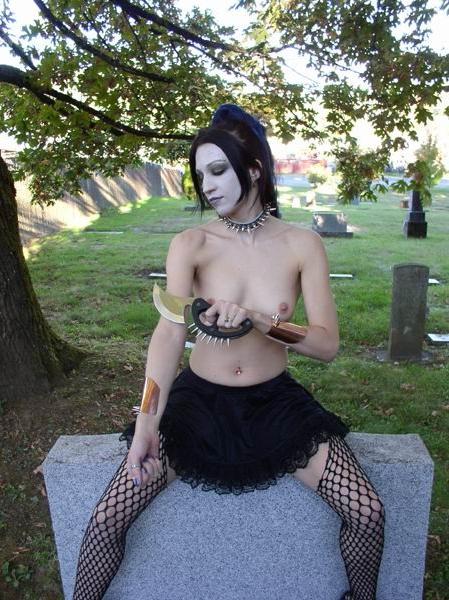 16P Outdoor gothic girl posing with a knife
