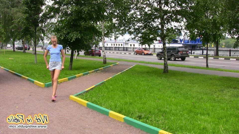 14P Gal with long ponytail spreading and wetting herself on a garden bench