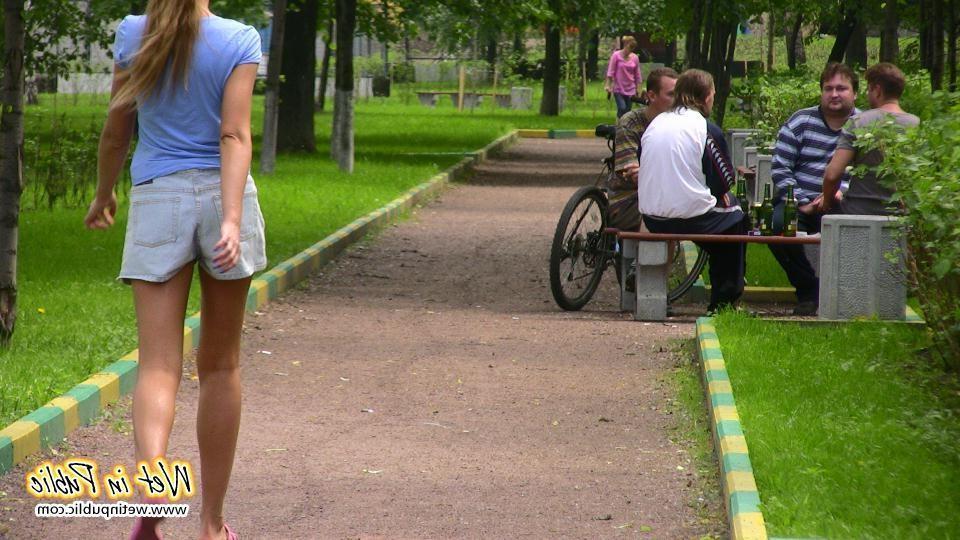 14P Gal with long ponytail spreading and wetting herself on a garden bench