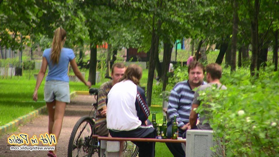14P Gal with long ponytail spreading and wetting herself on a garden bench