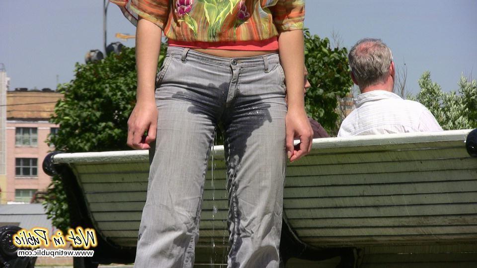 14P Pretty lady pees right through her jeans making them all wet and smelly