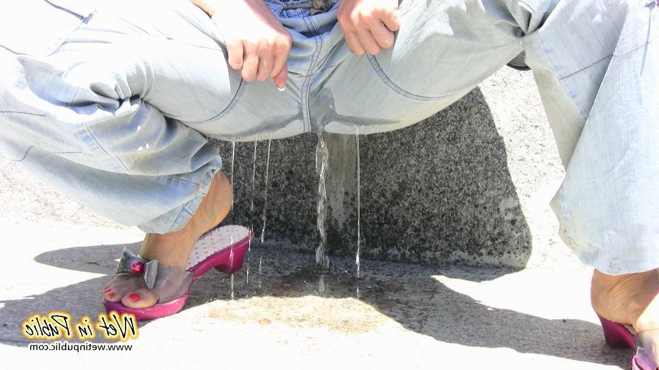 10P Chick squats down and a powerful spurt of pee bursts through her pants
