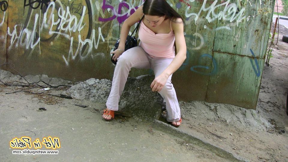 10P Longhaired amateur desperate to pee wets her pants and the asphalt