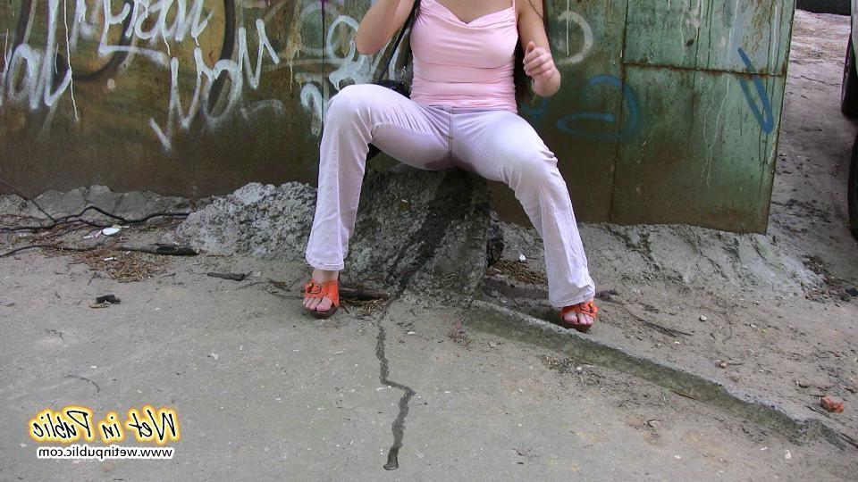 10P Longhaired amateur desperate to pee wets her pants and the asphalt
