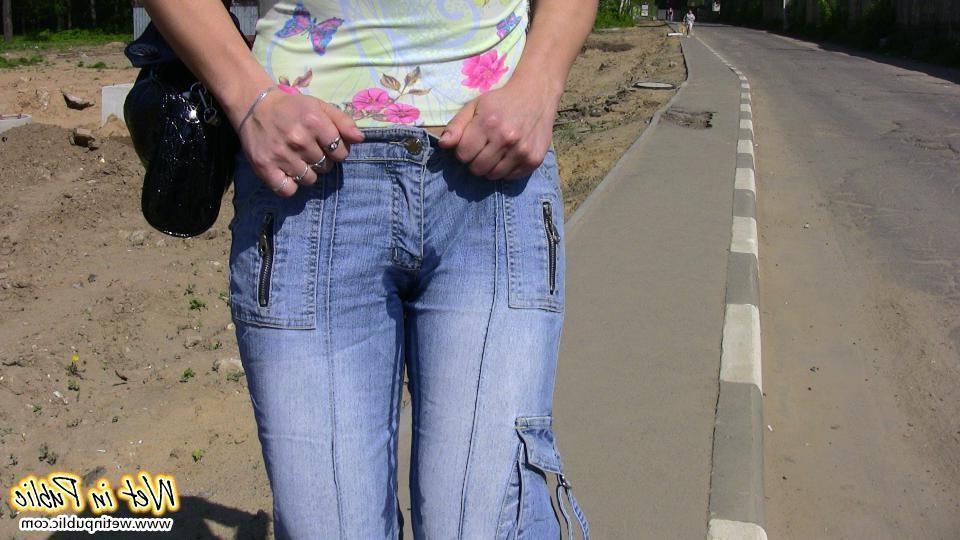12P Big-breasted bombshell with long hair pisses in her jeans on the road