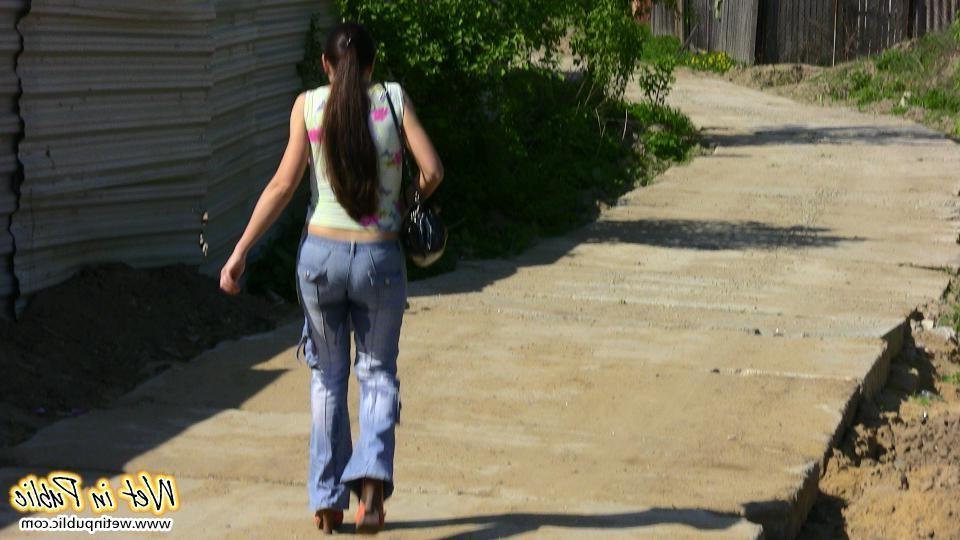 12P Big-breasted bombshell with long hair pisses in her jeans on the road