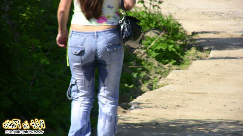 12P Big-breasted bombshell with long hair pisses in her jeans on the road