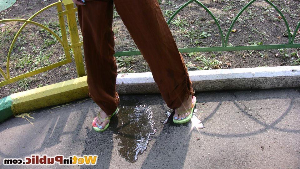 14P Blonde chick wets herself and leaves a puddle of piss on a sidewalk