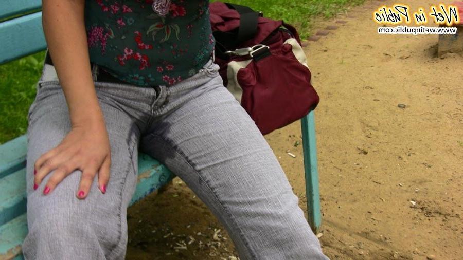 15P Fleshy gal shamefully empties her bladder in the gray jeans on a bench