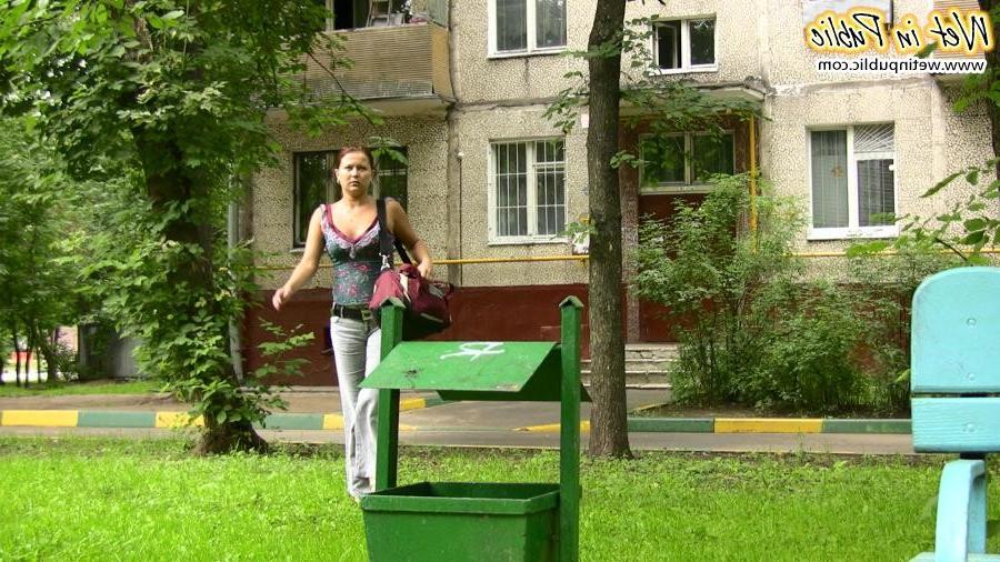 15P Fleshy gal shamefully empties her bladder in the gray jeans on a bench