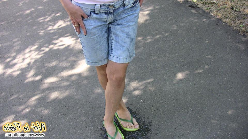 15P Moistened jean shorts and wet sexy legs of a slender unlucky cutey
