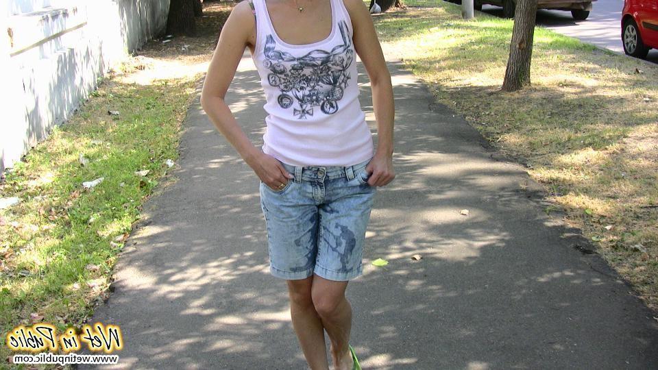 15P Moistened jean shorts and wet sexy legs of a slender unlucky cutey