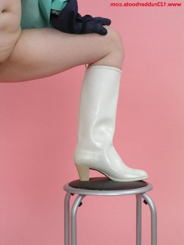 20P Girl with big tits in rubber boots and rainwear