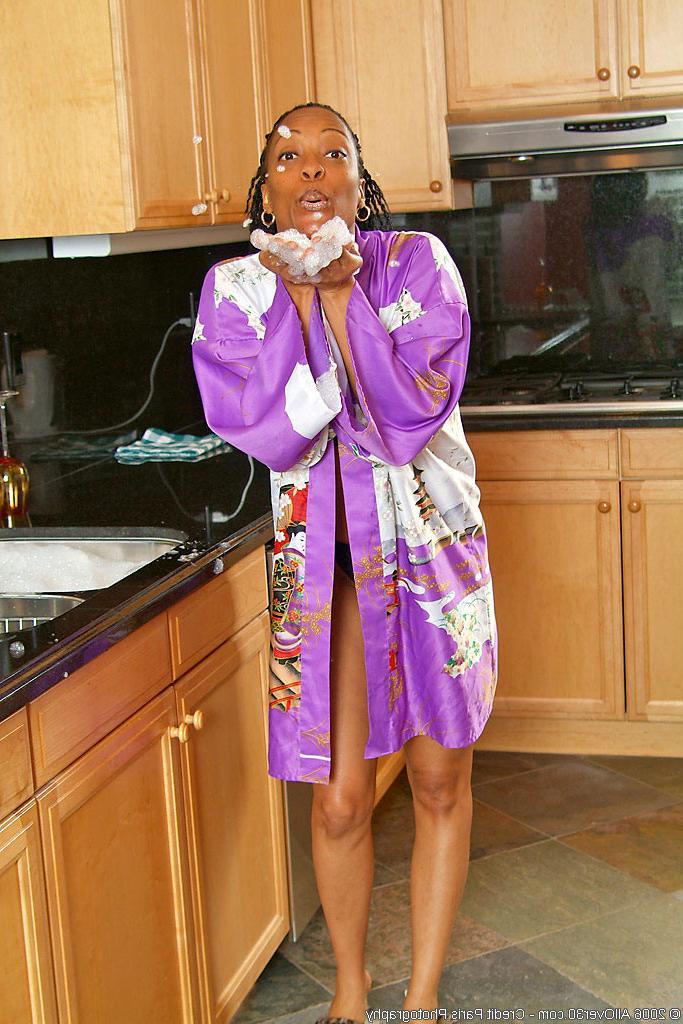 15P 37 year old ebony chick gets naughty in the kitchen